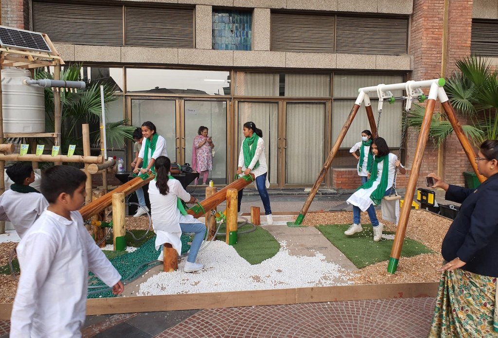 Schools try out the interactive playground gardens and enjoy some fun time between performances.
